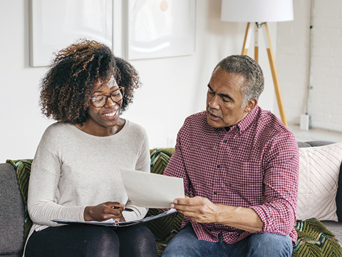 two people looking at documents